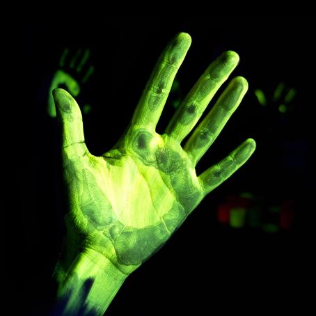 Fluorescent image of a right hand illuminated by UV radiation. Henri Becquerel also experimented with a similar type of luminescence when he placed illuminated minerals on a photographic plate. (Source: © devmarya / stock.adobe.com) Fluorescent image of a right hand illuminated by UV radiation. Henri Becquerel also experimented with a similar type of luminescence when he placed illuminated minerals on a photographic plate. (Source: © devmarya / stock.adobe.com)