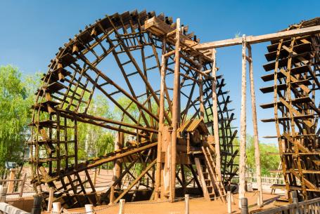 Wooden water wheels working on the Yellow River in the town of Lanzhou, China. With diameters ranging from 10 to 20 meters, they are used to pump irrigation water. (Source: © Roberto Lo Savio / stock.adobe.com) Wooden water wheels working on the Yellow River in the town of Lanzhou, China. With diameters ranging from 10 to 20 meters, they are used to pump irrigation water. (Source: © Roberto Lo Savio / stock.adobe.com)