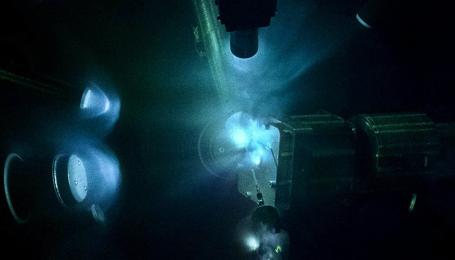 OMEGA laser compressing target. (Credit: © LLE / https://lasers.llnl.gov) OMEGA laser compressing target. (Credit: © LLE / https://lasers.llnl.gov)
